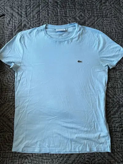 Polera celeste LACOSTE - miniatura 1