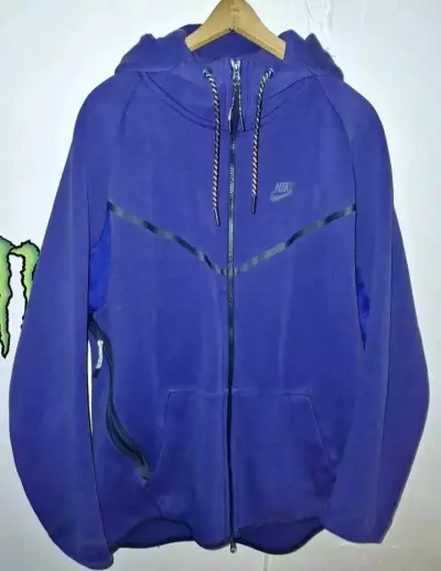 Polerón azul marca Nike tech - miniatura 1