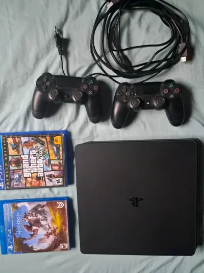 Consola PS4 con juegos y controles - miniatura 1