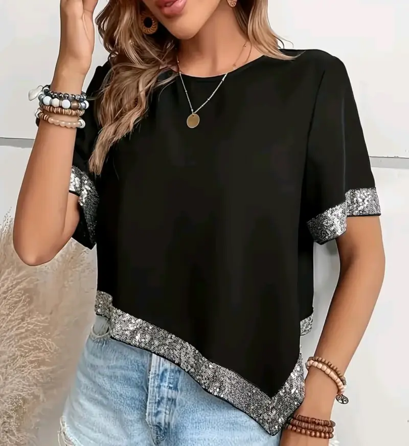 Polera negra con detalles brillantes - 1
