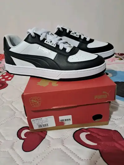 Zapatillas Puma blancas y negras - miniatura 1