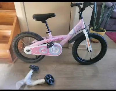 Bicicleta infantil rosada con rueditas - miniatura 1