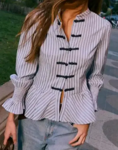 Blusa peplum rayada con hebillas - miniatura 1