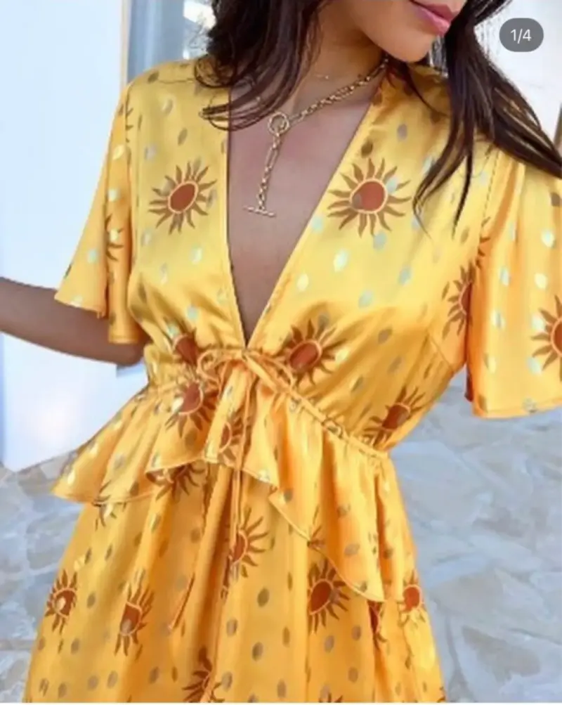 Vestido amarillo con estampado solar - 1