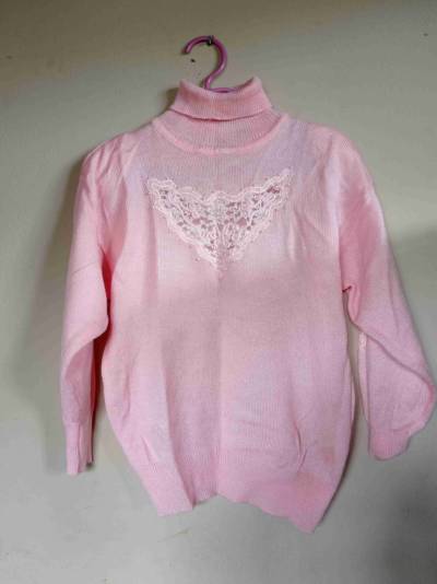 Sweater rosa con cuello alto - miniatura 1