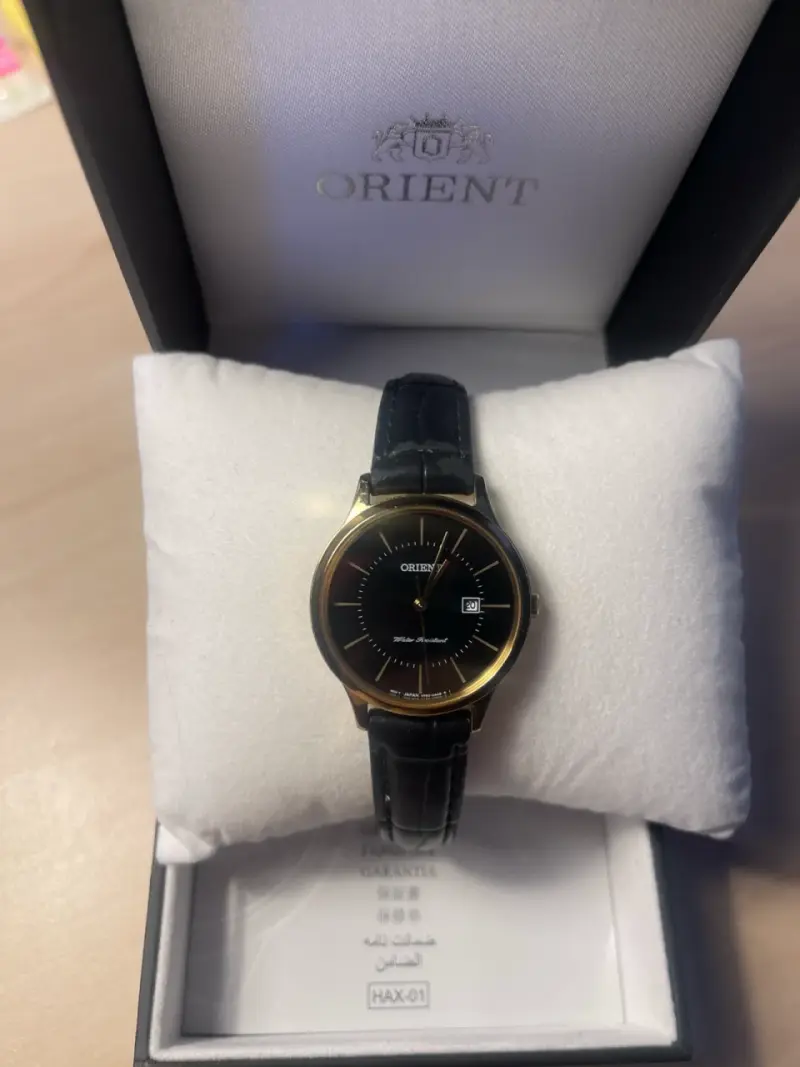 Reloj Orient dorado y negro - 1