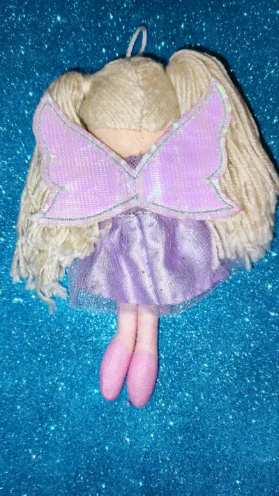 Muñeca de trapo con vestido lila - miniatura 2