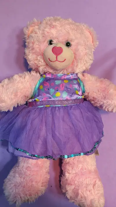 Osito BAB rosado con vestido púrpura - miniatura 1