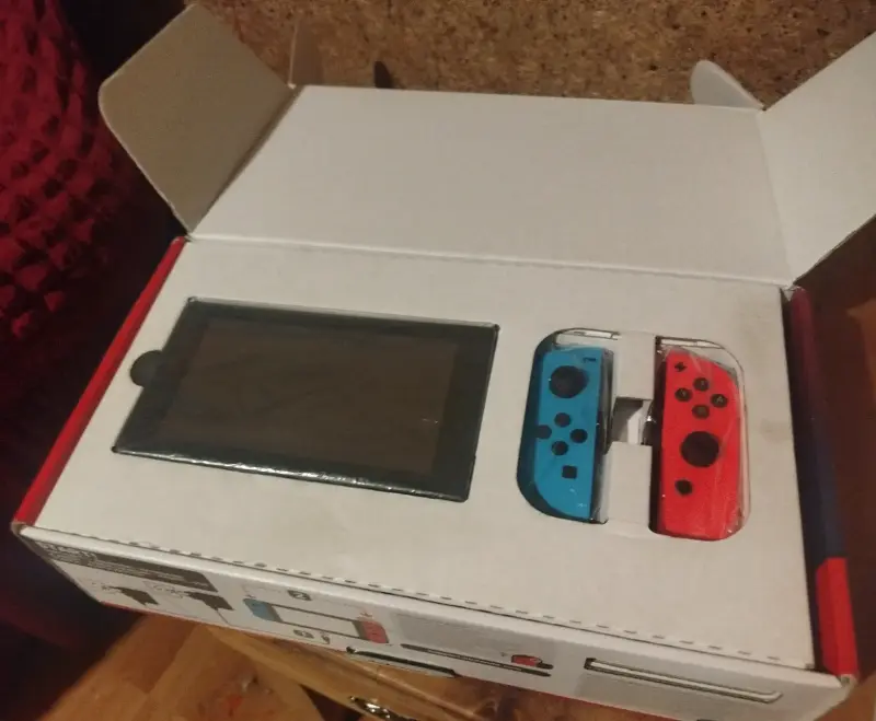 Nintendo switch neon v2 de 32 GB más 128 GB extra - 1