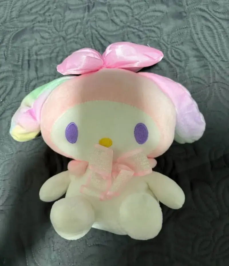 Peluche pastel con lazo rosado