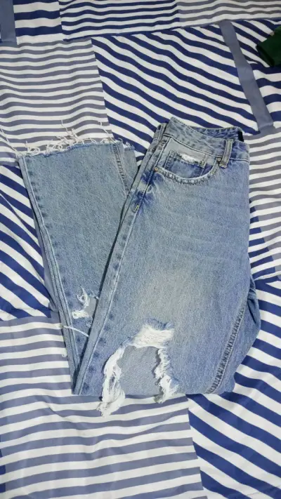 Jeans desgastados azules - miniatura 1