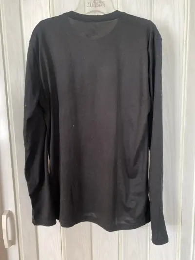 Polera negra Nike Florida Strong - miniatura 3
