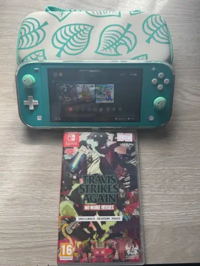 Nintendo Switch Lite turquesa + juegos - miniatura 1