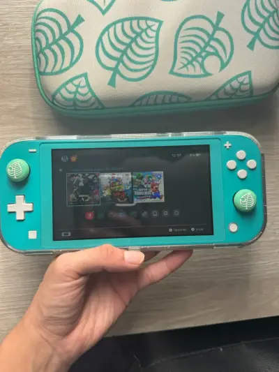 Nintendo Switch Lite turquesa + juegos - miniatura 2