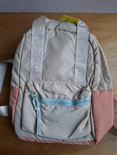 Mochila sin uso beige con detalles rosados - miniatura 1