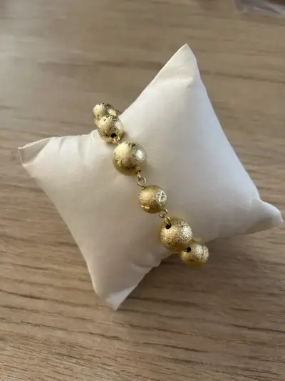 Pulsera dorada de esferas - miniatura 1
