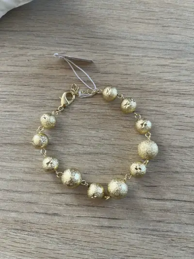 Pulsera dorada de esferas - miniatura 2