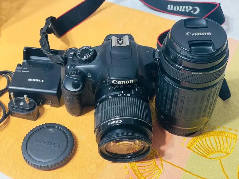 Cámara Canon EOS con lentes y cargador - 1