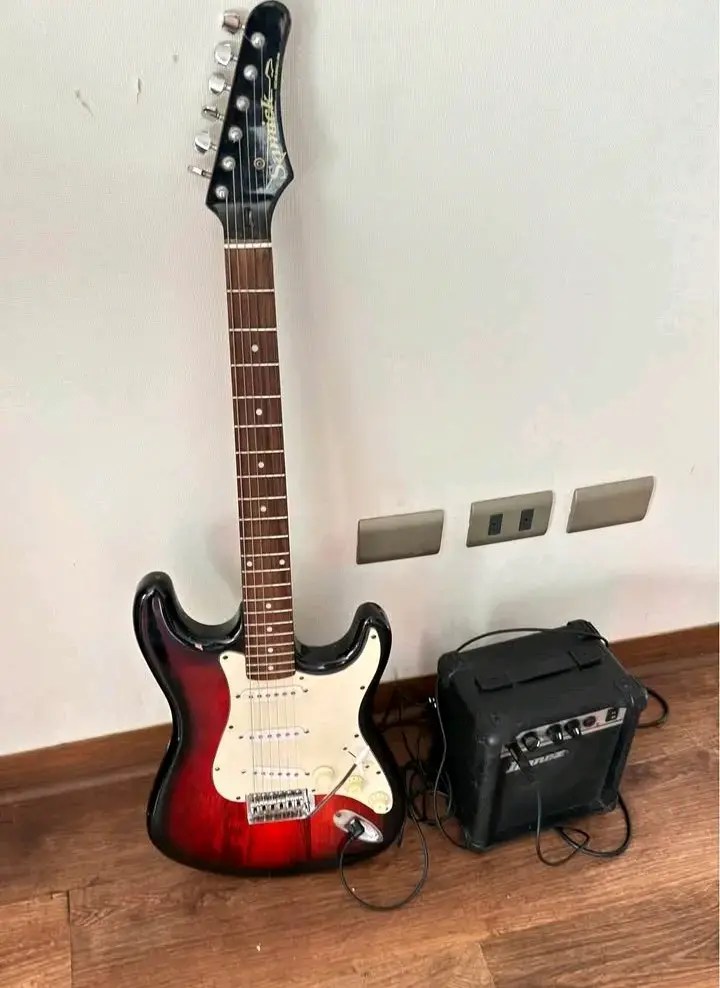 Guitarra eléctrica con amplificador