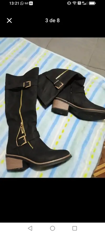 Botas negras con hebillas - miniatura 1