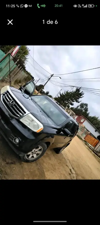 Camioneta Honda negra - miniatura 1