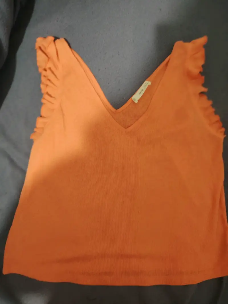 Top anaranjado con volantes mango