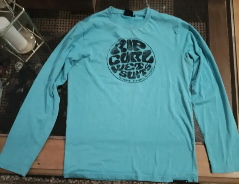 Polera manga larga turquesa Rip Curl