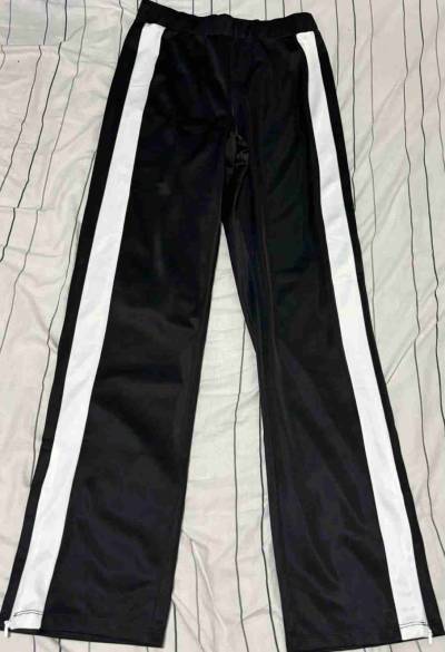 Pantalones deportivos negros con franjas - miniatura 1