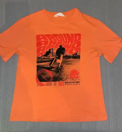Polera H y M naranja con diseño skate - miniatura 1