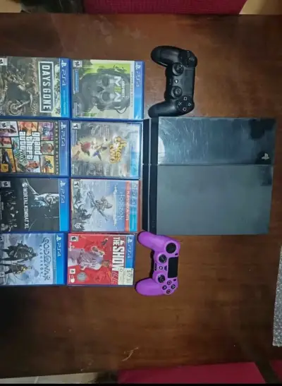 Consola PS4 con juegos y controles - miniatura 1