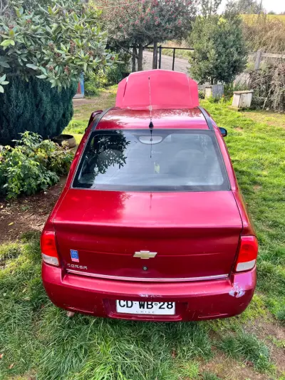 Chevrolet Corsa 2010 rojo - miniatura 1