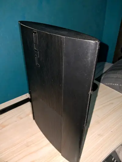 Consola PlayStation 3 negra con juegos - miniatura 3