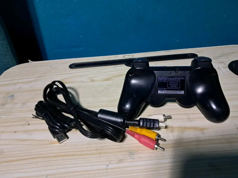 Consola PlayStation 3 negra con juegos - 5