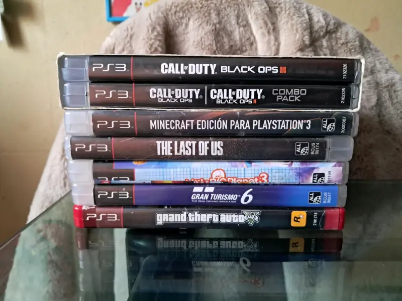 Consola PlayStation 3 negra con juegos - 6