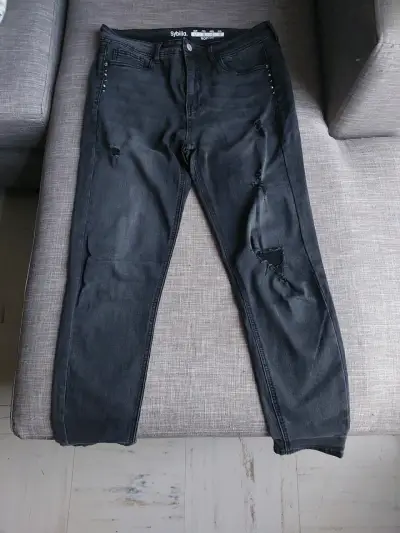 Pantalones jeans negros rasgados - miniatura 1