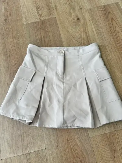 Falda beige con bolsillos - miniatura 1