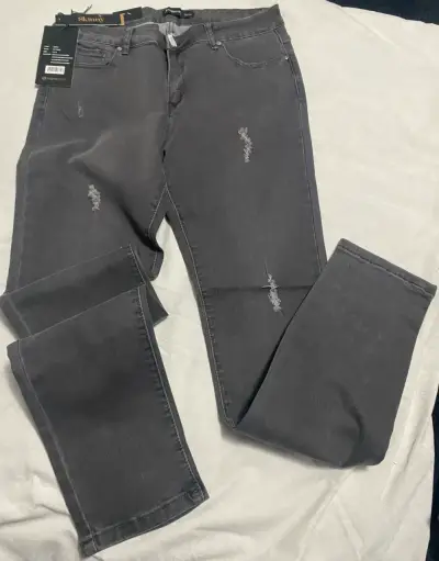 Jeans grises con roturas - miniatura 1