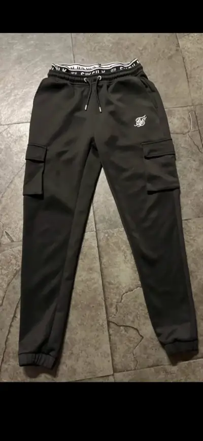 Pantalones jogger negros con bolsillos - miniatura 1