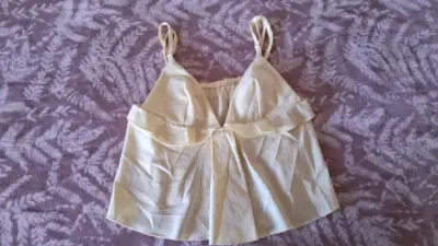 Blusa blanca sin mangas - miniatura 1