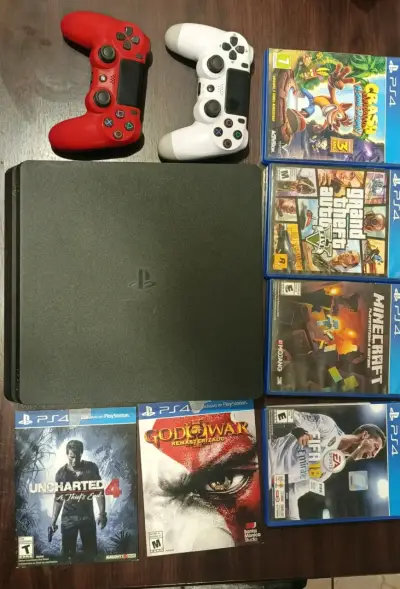 Consola PS4 con juegos y controles - miniatura 1