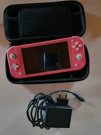 Nintendo Switch Lite Coral 32gb - miniatura 1