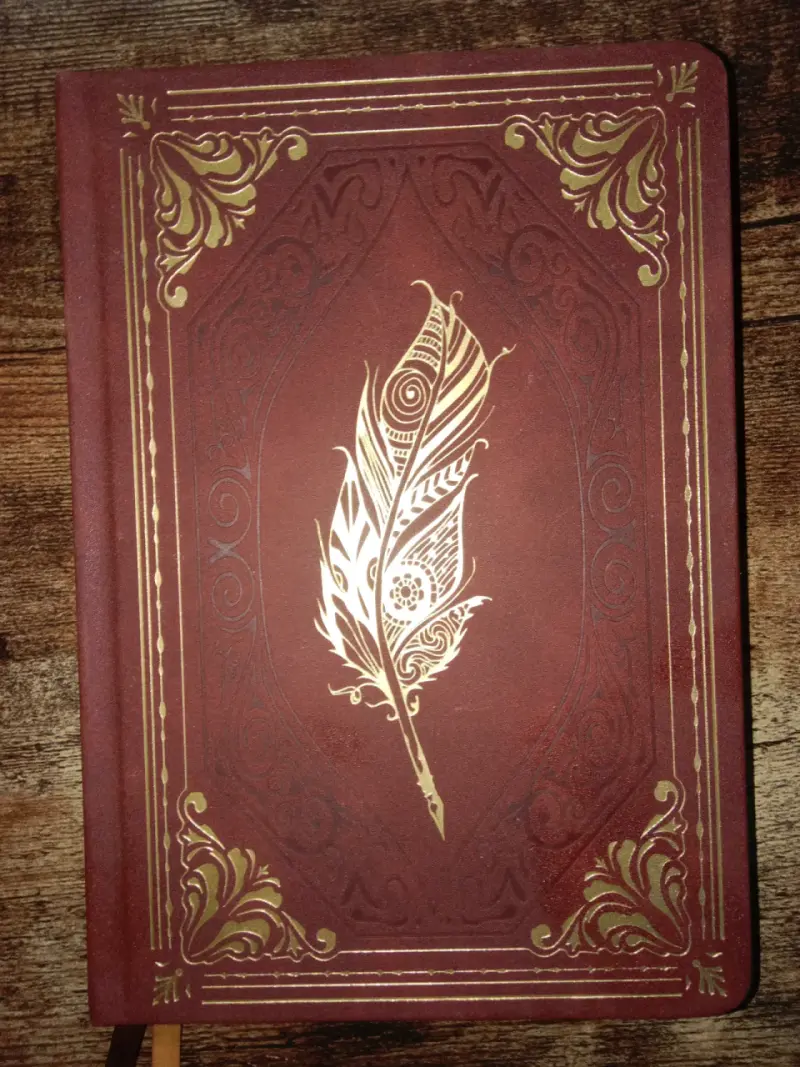 Cuaderno vintage con diseño de pluma - 1
