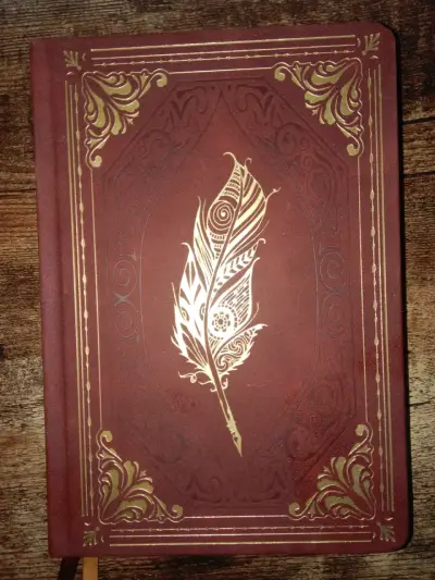 Cuaderno vintage con diseño de pluma - miniatura 1