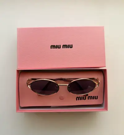 Gafas de sol Miu Miu doradas - miniatura 1