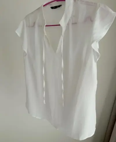 Blusa blanca sin mangas - miniatura 1