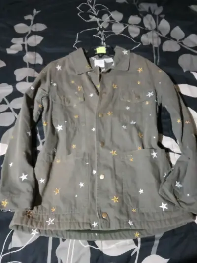 Chaqueta verde con estrellas marca umbrale - miniatura 1