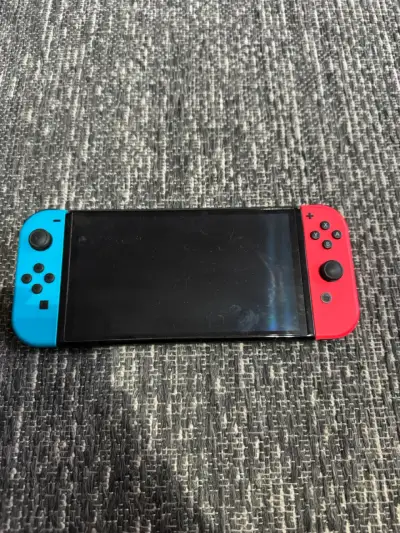 Nintendo Switch Neon Azul/Rojo con Dock y Cargador - miniatura 1