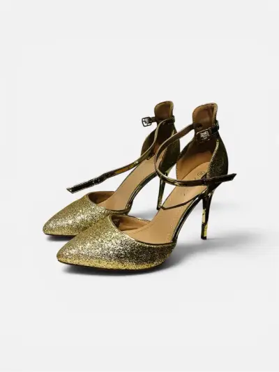 Tacones dorados y negros con brillo - miniatura 1