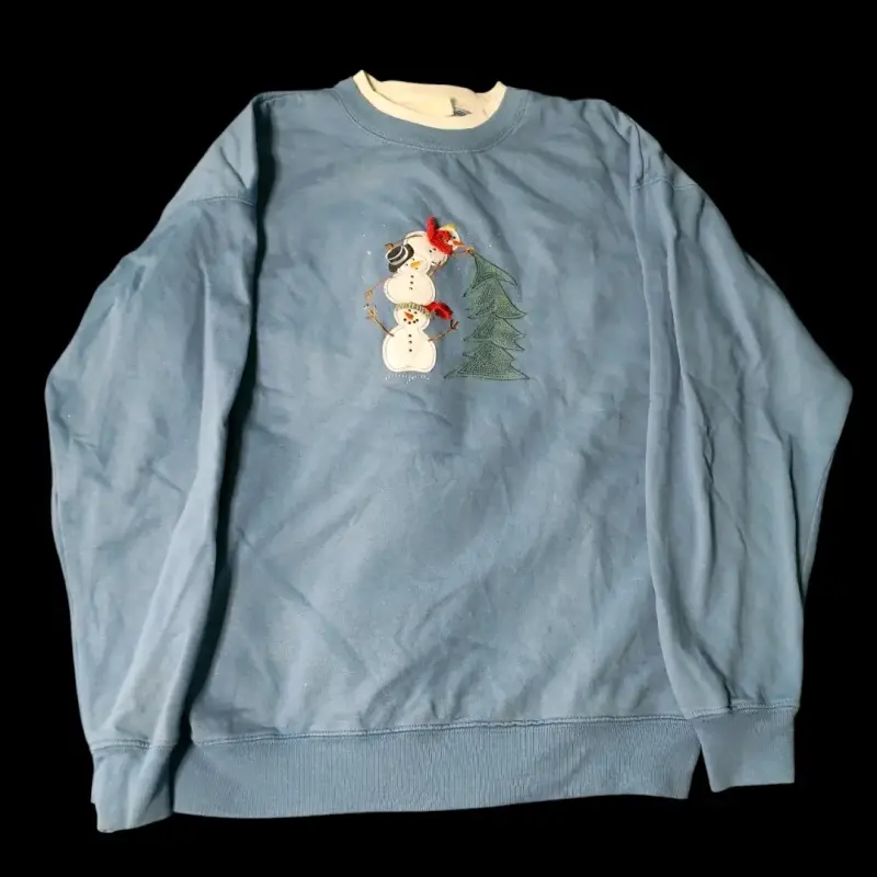 Suéter celeste con muñeco de nieve - 1
