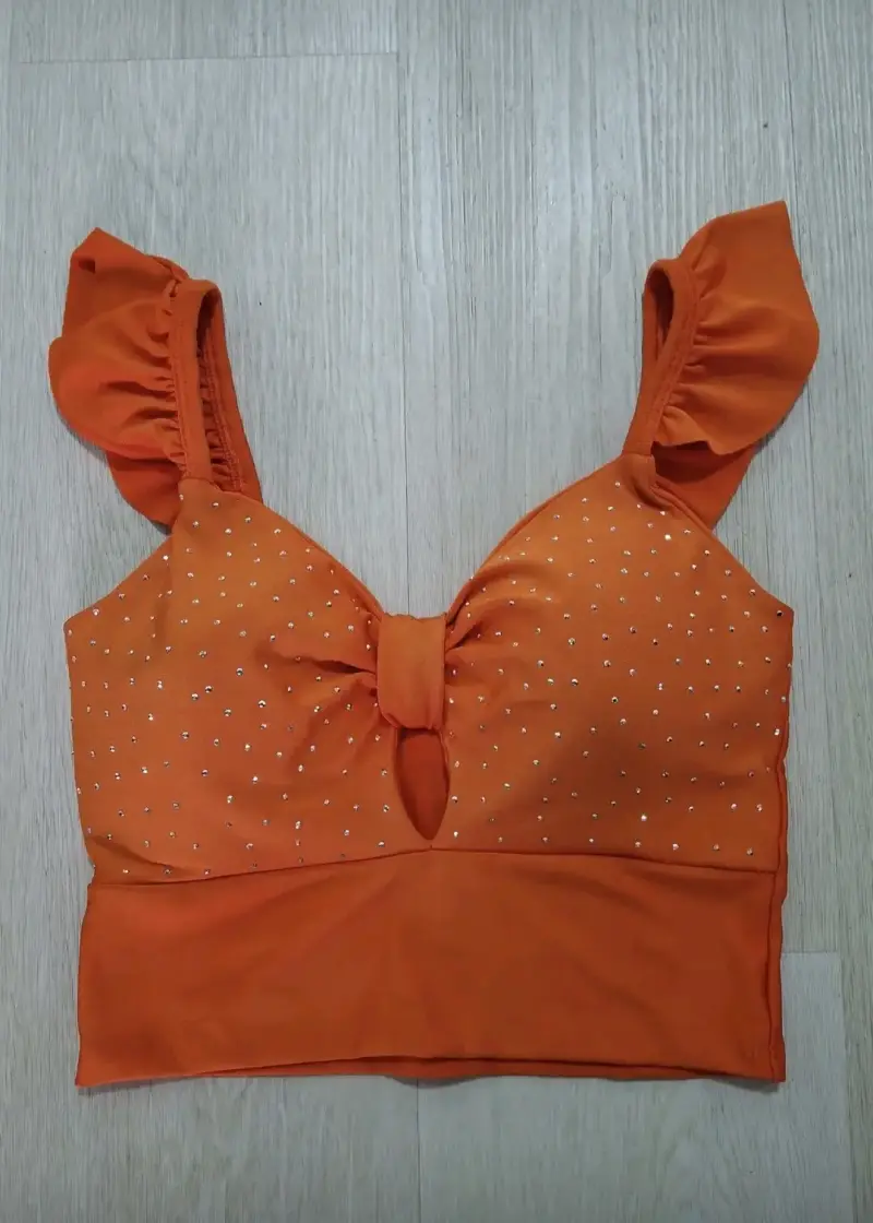 Top naranja con brillos